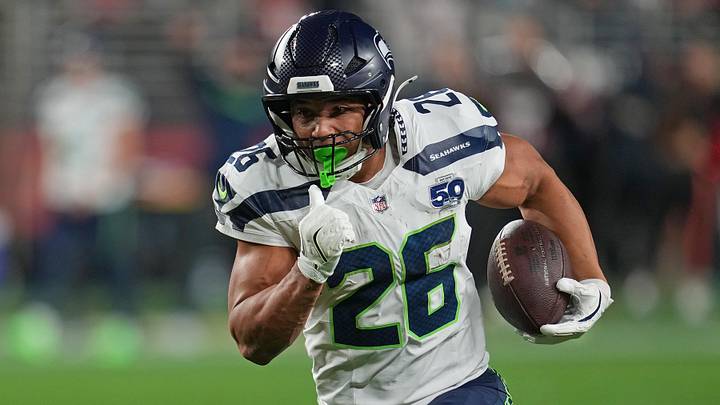 Jan 3, 2026; Santa Clara, California, USA; Seattle Seahawks running back Zach Charbonnet (26) rushes the ball against the San Francisco 49ers during the first half at Levi's Stadium. Mandatory Credit: Neville E. Guard-Imagn Images