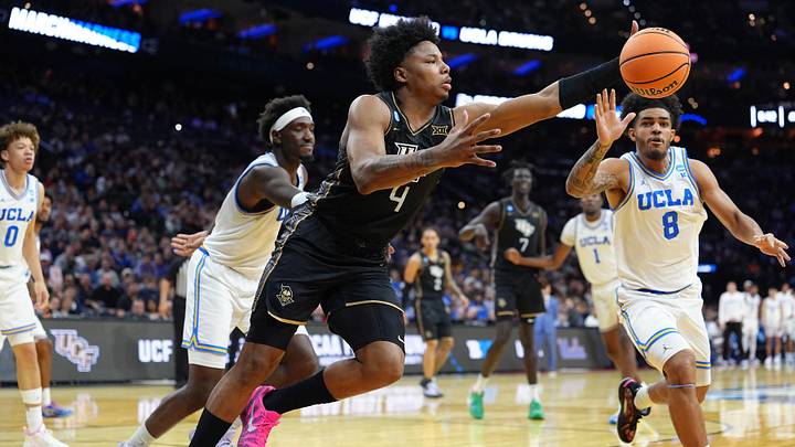 Mar 20, 2026; Philadelphia, PA, USA; UCF Knights forward Jamichael Stillwell (4) reaches for a rebound against the UCLA Bruins in the second half during a first round game of the men's 2026 NCAA Tournament at Xfinity Mobile Arena. Mandatory Credit: Kyle Ross-Imagn Images Mar 20, 2026; Philadelphia, PA, USA; UCF Knights forward Jamichael Stillwell (4) reaches for a rebound against the UCLA Bruins in the second half during a first round game of the men's 2026 NCAA Tournament at Xfinity Mobile Arena. Mandatory Credit: Kyle Ross-Imagn Images