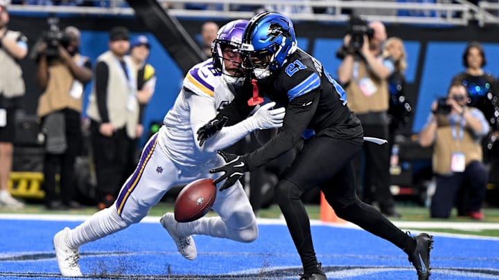 Jan 5, 2025; Detroit, Michigan, USA; Detroit Lions cornerback Amik Robertson (21) breaks up a pass in the end zone intended for Minnesota Vikings wide receiver Justin Jefferson (18) in the second quarter at Ford Field. Jan 5, 2025; Detroit, Michigan, USA; Detroit Lions cornerback Amik Robertson (21) breaks up a pass in the end zone intended for Minnesota Vikings wide receiver Justin Jefferson (18) in the second quarter at Ford Field.