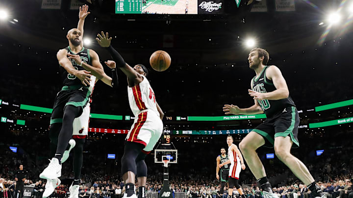 Dec 2, 2024; Boston, Massachusetts, USA: Boston Celtics guard Derrick White (9) passes to center Luke Kornet (40) past Miami Heat center Bam Adebayo (13) during the first half at TD Garden. Mandatory Credit: Winslow Townson-Imagn Images Dec 2, 2024; Boston, Massachusetts, USA: Boston Celtics guard Derrick White (9) passes to center Luke Kornet (40) past Miami Heat center Bam Adebayo (13) during the first half at TD Garden. Mandatory Credit: Winslow Townson-Imagn Images