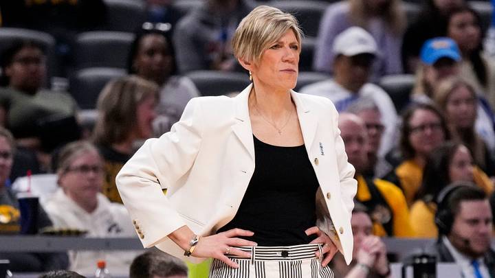 Iowa Hawkeyes head coach Jan Jensen watches the game from the sidelines Sunday, March 8, 2026, during the Big Ten Tournament Championship game at Gainbridge Fieldhouse in Indianapolis. UCLA Bruins defeated the Iowa Hawkeyes, 96-45, for back to back Big Ten championships.
