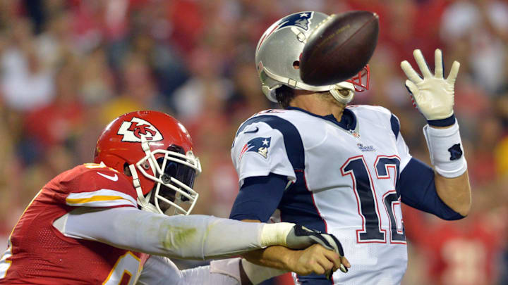 Sep 29, 2014; Kansas City, MO, USA; Kansas City Chiefs outside linebacker Tamba Hali (91) hits New England Patriots quarterback Tom Brady (12) while passing during the second half at Arrowhead Stadium. The Chiefs won 41-14. Mandatory Credit: Denny Medley-Imagn Images Sep 29, 2014; Kansas City, MO, USA; Kansas City Chiefs outside linebacker Tamba Hali (91) hits New England Patriots quarterback Tom Brady (12) while passing during the second half at Arrowhead Stadium. The Chiefs won 41-14. Mandatory Credit: Denny Medley-Imagn Images