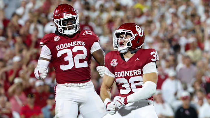 OU linebacker Owen Heinecke , right, celebrates with defensive end R Mason Thomas during the Sooners' win over Michigan on Sept. 6. Oklahoma's defense continues to show growth in the fourth season under Brent Venables.