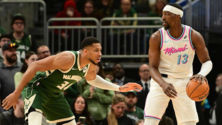 Jan 23, 2025; Milwaukee, Wisconsin, USA;  Miami Heat center Bam Adebayo (13) is guarded by Milwaukee Bucks forward Giannis Antetokounmpo (34) in the first quarter at Fiserv Forum. Mandatory Credit: Benny Sieu-Imagn Images