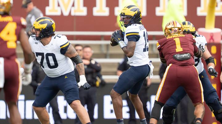 Oct 3, 2026; Minneapolis, Minnesota, USA;  Michigan Wolverines quarterback Bryce Underwood (19) steps back to pass against the Minnesota Golden Gophers in the fourth quarter at Huntington Bank Stadium.  Mandatory Credit: Matt Blewett-Imagn Images