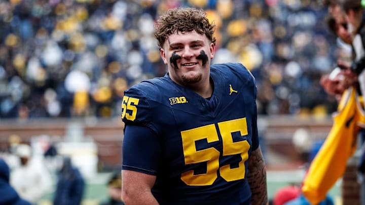 Blue Team defensive lineman Mason Graham (55) walks up the tunnel for halftime during the spring game at Michigan Stadium in Ann Arbor on Saturday, April 20, 2024.