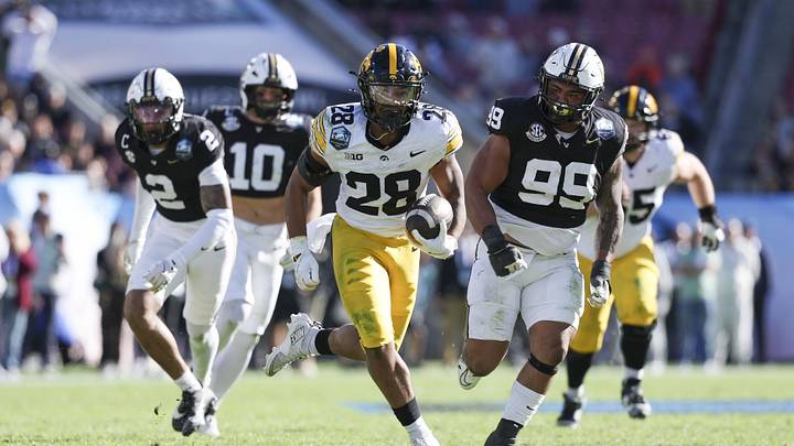 Dec 31, 2025; Tampa, FL, USA; Iowa Hawkeyes running back Kamari Moulton (28) runs with the ball against the Vanderbilt Commodores in the third quarter during the ReliaQuest Bowl at Raymond James Stadium. Mandatory Credit: Nathan Ray Seebeck-Imagn Images Dec 31, 2025; Tampa, FL, USA; Iowa Hawkeyes running back Kamari Moulton (28) runs with the ball against the Vanderbilt Commodores in the third quarter during the ReliaQuest Bowl at Raymond James Stadium. Mandatory Credit: Nathan Ray Seebeck-Imagn Images