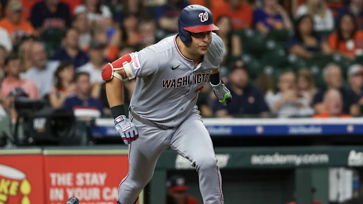 Jul 28, 2025; Houston, Texas, USA; Washington Nationals first baseman Nathaniel Lowe (33) hits a RBI double against the Houston Astros in the sixth inning at Daikin Park. Mandatory Credit: Thomas Shea-Imagn Images