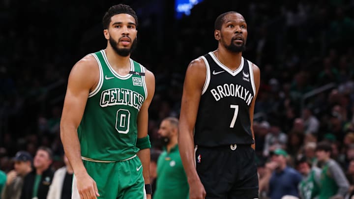 Mar 6, 2022; Boston, Massachusetts, USA; Boston Celtics forward Jayson Tatum (0) and Brooklyn Nets