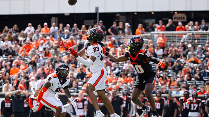 Oregon State's Exodus Ayers, left, and Taz Reddicks jump for the tipped ball during the Oregon State Spring Game at Reser Stadium on Saturday, April 19, 2025, in Corvallis, Ore.