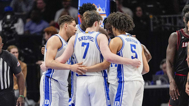 Duke Blue Devils huddle during a free throw during the 2025 ACC Conference Championship game at Spectrum Center.