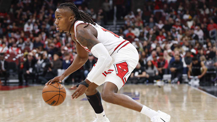 Nov 22, 2025; Chicago, Illinois, USA; Chicago Bulls guard Ayo Dosunmu (11) drives to the basket against the Washington Wizards during the first half at United Center. Mandatory Credit: Kamil Krzaczynski-Imagn Images