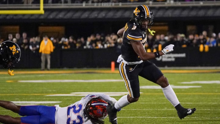 Nov 18, 2023; Columbia, Missouri, USA; Missouri Tigers wide receiver Luther Burden III (3) runs the ball as Florida Gators cornerback Jaydon Hill (23) attempts the tackle during the first half at Faurot Field at Memorial Stadium. Mandatory Credit: Denny Medley-USA TODAY Sports