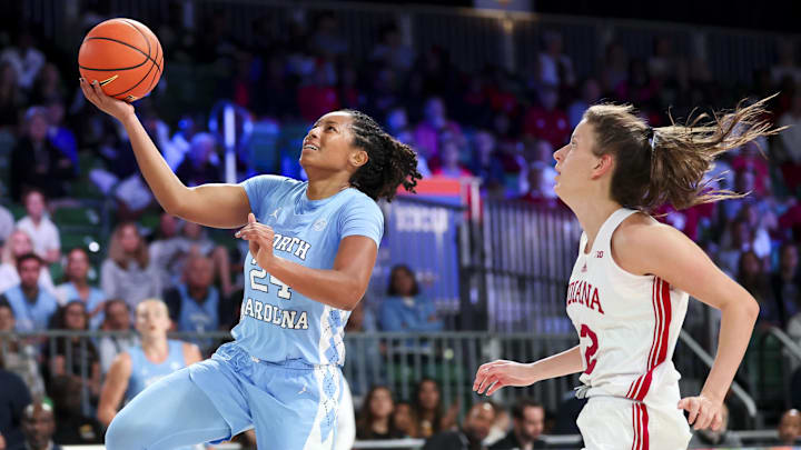 Nov 25, 2024; Paradise Island, Bahamas, BHS; North Carolina Tar Heels guard Indya Nivar (24) drives to the basket as Indiana Hoosiers guard Yarden Garzon (12) defends during the second half at the Atlantis Resort. Mandatory Credit: Kevin Jairaj-Imagn Images