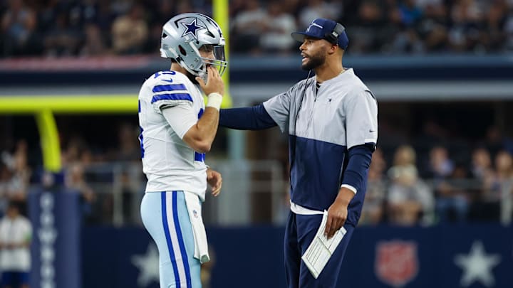 Dallas Cowboys quarterback Dak Prescott speaks with Will Grier during the first half against the Las Vegas Raiders.