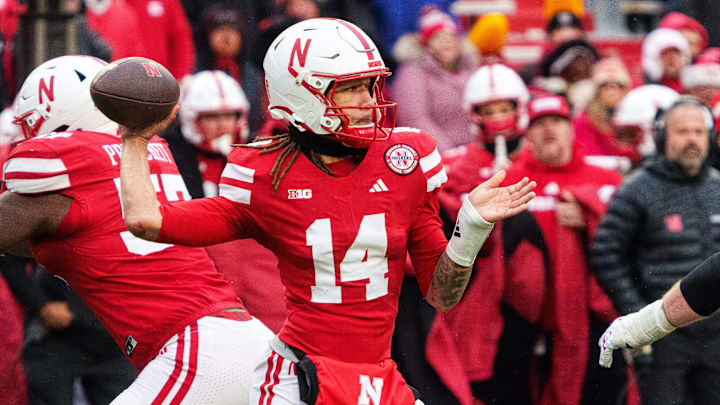 Nov 28, 2025; Lincoln, Nebraska, USA; Nebraska Cornhuskers quarterback TJ Lateef (14) passes against the Iowa Hawkeyes during the fourth quarter at Memorial Stadium. Nov 28, 2025; Lincoln, Nebraska, USA; Nebraska Cornhuskers quarterback TJ Lateef (14) passes against the Iowa Hawkeyes during the fourth quarter at Memorial Stadium.