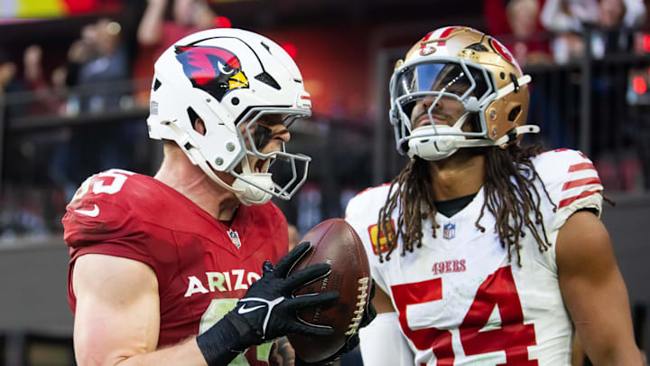 Jan 5, 2025; Glendale, Arizona, USA; Arizona Cardinals tight end Trey McBride (85) celebrates after catching a touchdown pass against San Francisco 49ers linebacker Fred Warner (54) in the first half at State Farm Stadium. Mandatory Credit: Mark J. Rebilas-Imagn Images