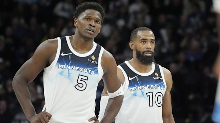 Minnesota Timberwolves guards Anthony Edwards (5) and Mike Conley watch as a member of the Atlanta Hawks shoots free throws in the fourth quarter at Target Center in Minneapolis on Jan. 27, 2025.