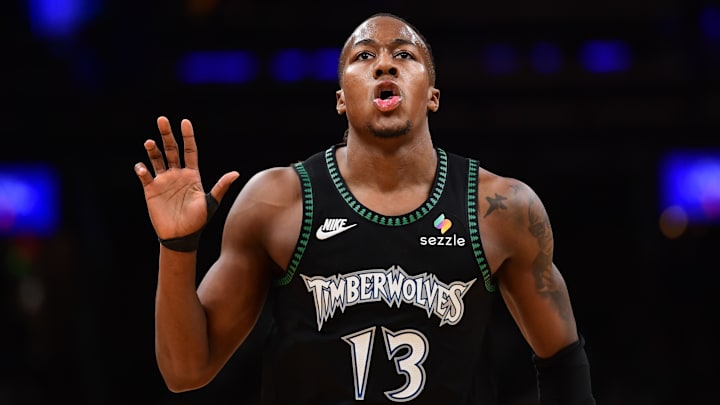 Mar 22, 2026; Boston, Massachusetts, USA; Minnesota Timberwolves guard Ayo Dosunmu (13) reacts after making a basket during the first half against the Boston Celtics at TD Garden. Mandatory Credit: Bob DeChiara-Imagn Images