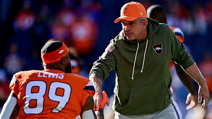 DENVER, CO - NOVEMBER 16: Denver Broncos head coach Sean Payton greets tight end Marcedes Lewis (89) before a game between the Kansas City Chiefs and the Denver Broncos at Empower Field at Mile High on November 16, 2025 in Denver, Colorado. 