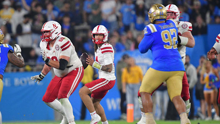 Nov 8, 2025; Pasadena, California, USA; Nebraska Cornhuskers quarterback TJ Lateef (14) drops back to pass against the UCLA Bruins during the second half at the Rose Bowl. 