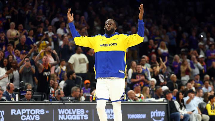 Apr 17, 2026; Phoenix, Arizona, USA; Golden State Warriors forward Draymond Green gestures the crowd after being ejected against the Phoenix Suns during the closing seconds of the play-in rounds of the 2026 NBA Playoffs at Mortgage Matchup Center. Mandatory Credit: Mark J. Rebilas-Imagn Images
