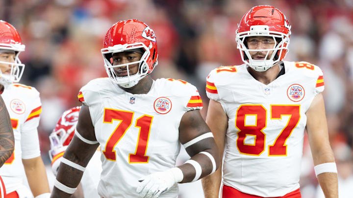 Aug 9, 2025; Glendale, Arizona, USA; Kansas City Chiefs offensive tackle Josh Simmons (71) and tight end Travis Kelce (87) against the Arizona Cardinals during a preseason NFL game at State Farm Stadium. Mandatory Credit: Mark J. Rebilas-Imagn Images