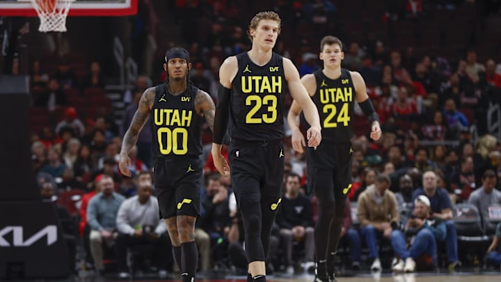 Nov 6, 2023; Chicago, Illinois, USA; Utah Jazz forward Lauri Markkanen (23), Utah Jazz guard Jordan Clarkson (00) and Utah Jazz center Walker Kessler (24) walk on the court during the first half of a basketball game against the Chicago Bulls at United Center. Mandatory Credit: Kamil Krzaczynski-Imagn Images