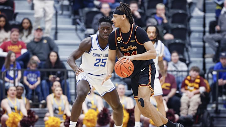 Feb 13, 2026; Chicago, Illinois, USA; Saint Louis Billikens forward Paul Otieno (25) defends against Loyola Chicago Ramblers center Miles Rubin (24) during the second half at Joseph J. Gentile Arena. Mandatory Credit: Kamil Krzaczynski-Imagn Images` Feb 13, 2026; Chicago, Illinois, USA; Saint Louis Billikens forward Paul Otieno (25) defends against Loyola Chicago Ramblers center Miles Rubin (24) during the second half at Joseph J. Gentile Arena. Mandatory Credit: Kamil Krzaczynski-Imagn Images`