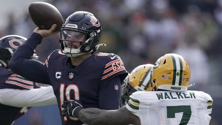 Nov 17, 2024; Chicago, Illinois, USA; Chicago Bears quarterback Caleb Williams (18) is pressured by Green Bay Packers linebacker Quay Walker (7) during the third quarter of their game Sunday, November 17, 2024 at Soldier Field in Chicago, Illinois. The Green Bay Packers beat the Chicago Bears 20-19.  Mandatory Credit: Mark Hoffman/USA TODAY Network via Imagn Images 