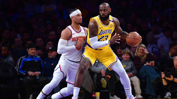 Mar 6, 2025; Los Angeles, California, USA;  Los Angeles Lakers forward LeBron James (23) moves the ball against New York Knicks guard Josh Hart (3) during the first half at Crypto.com Arena. Mandatory Credit: Gary A. Vasquez-Imagn Images