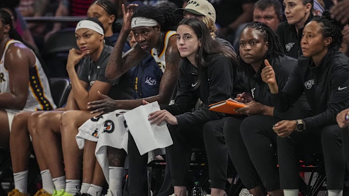 Jun 10, 2025; College Park, Georgia, USA; Indiana Fever injured guard Caitlin Clark (22) follows the action from the bench against the Atlanta Dream during the second half at Gateway Center Arena at College Park. Mandatory Credit: Dale Zanine-Imagn Images