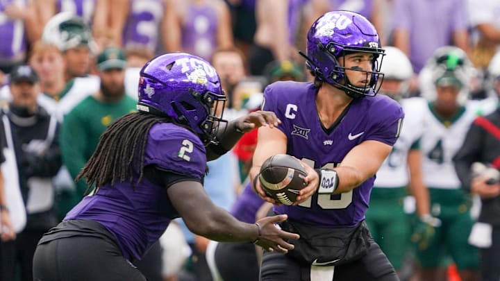 Oct 18, 2025; Fort Worth, Texas, USA; TCU Horned Frogs quarterback Josh Hoover (10) hands off to running back Kevorian Barnes (2) against the Baylor Bears during the second half of a game at Amon G. Carter Stadium. Mandatory Credit: Raymond Carlin III-Imagn Images