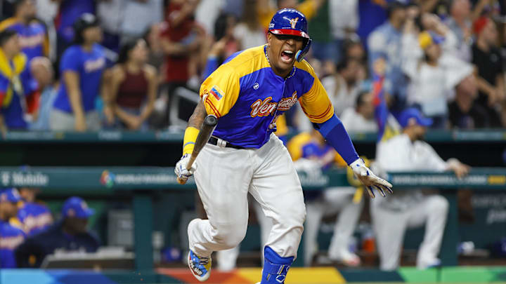 Mar 18, 2023; Miami, Florida, USA; Venezuela catcher Salvador Perez (13) reacts after an hitting an RBI double during the fifth inning against the USA at LoanDepot Park. Mandatory Credit: Sam Navarro-Imagn Images