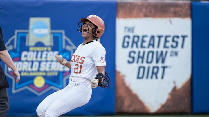 Jun 6, 2025; Oklahoma City, OK, USA;  Texas Longhorns outfielder Kayden Henry (21) yells after scoring a run in the first inning against the Texas Tech Red Raiders during game three of the NCAA Softball Women's College World Series finals at Devon Park. Mandatory Credit: Brett Rojo-Imagn Images