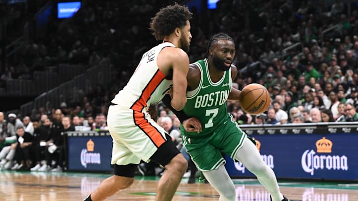 Dec 4, 2024; Boston, Massachusetts, USA; Boston Celtics guard Jaylen Brown (7) drives to the basket against Detroit Pistons guard Cade Cunningham (2) during the fourth quarter at the TD Garden. Mandatory Credit: Brian Fluharty-Imagn Images