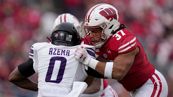 Wisconsin tight end Riley Nowakowski (37) blocks Northwestern defensive back Coco Azema (0) during the first quarter of their game Saturday, November 11, 2023 at Camp Randall Stadium in Madison, Wisconsin.