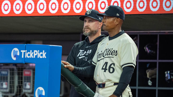 Minnesota Twins manager Rocco Baldelli and assistant bench coach/infield coach Tony Diaz (46) watch play during the fifth inning against the Miami Marlins at Target Field in Minneapolis on Sept. 26, 2024.