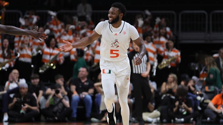 Mar 6, 2024; Coral Gables, Florida, USA; Miami Hurricanes guard Wooga Poplar (5) celebrates after scoring against the Boston College Eagles during the first half at Watsco Center. Mandatory Credit: Sam Navarro-USA TODAY Sports