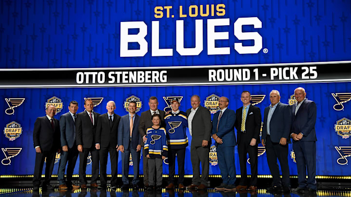Jun 28, 2023; Nashville, Tennessee, USA; St. Louis Blues draft pick Otto Stenberg stands with Blues staff after being selected with the twenty fifth pick in round one of the 2023 NHL Draft at Bridgestone Arena. Mandatory Credit: Christopher Hanewinckel-Imagn Images