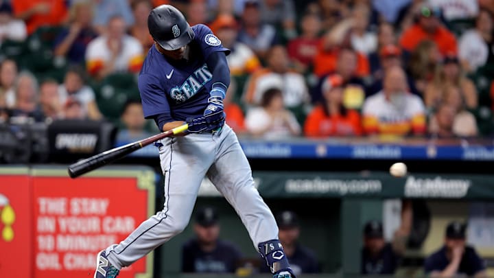 Sep 25, 2024; Houston, Texas, USA; Seattle Mariners second baseman Jorge Polanco (7) hits a single against the Houston Astros during the second inning at Minute Maid Park. 