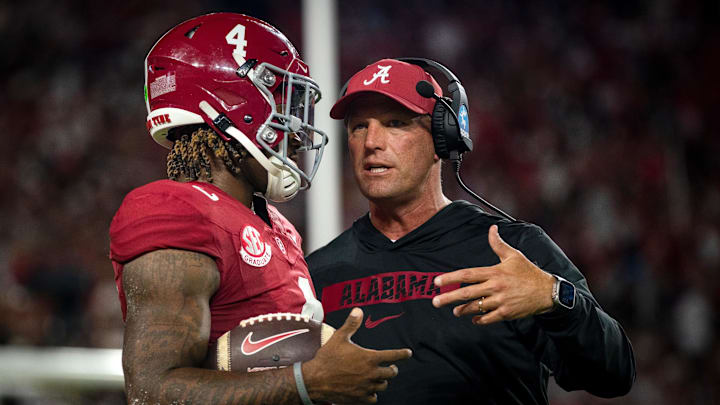 Alabama Crimson Tide quarterback Jalen Milroe and head coach Kalen DeBoer talk during a timeout in the first quarter against the Georgia Bulldogs at Bryant-Denny Stadium on September 28, 2024. Alabama Crimson Tide quarterback Jalen Milroe and head coach Kalen DeBoer talk during a timeout in the first quarter against the Georgia Bulldogs at Bryant-Denny Stadium on September 28, 2024.