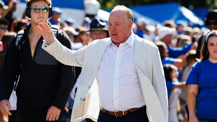 Aug 30, 2025; Lexington, Kentucky, USA; Kentucky Wildcats head coach Mark Stoops waves to the fans at Cat Walk before the game against the Toledo Rockets at Kroger Field. Mandatory Credit: Jordan Prather-Imagn Images