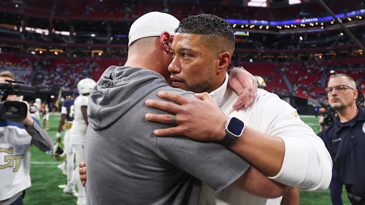 Oct 19, 2024; Atlanta, Georgia, USA; Notre Dame Fighting Irish head coach Marcus Freeman talks to Georgia Tech Yellow Jackets head coach Marcus Freeman after a game at Mercedes-Benz Stadium. Mandatory Credit: Brett Davis-Imagn Images
