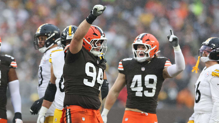 Dec 28, 2025; Cleveland, Ohio, USA; Cleveland Browns defensive tackle Mason Graham (94) and linebacker Carson Schwesinger (49) celebrate in the second quarter against the Pittsburgh Steelers at Huntington Bank Field. Mandatory Credit: Scott Galvin-Imagn Images