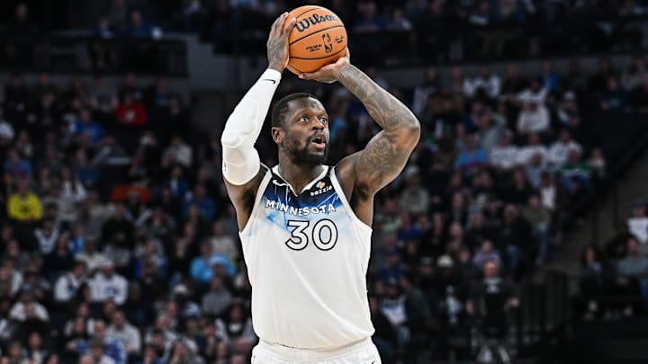 Jan 25, 2025; Minneapolis, Minnesota, USA; Minnesota Timberwolves forward Julius Randle (30) shoots a three point basket against the Denver Nuggets during the fourth quarter at Target Center. Jan 25, 2025; Minneapolis, Minnesota, USA; Minnesota Timberwolves forward Julius Randle (30) shoots a three point basket against the Denver Nuggets during the fourth quarter at Target Center.