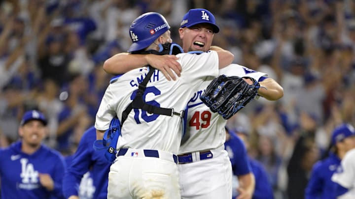 Oct 20, 2024; Los Angeles, California, USA; Los Angeles Dodgers pitcher Blake Treinen (49) celebrates with catcher Will Smith (16) after the final out to defeat the New York Mets in game six of the NLCS for the 2024 MLB playoffs at Dodger Stadium. Oct 20, 2024; Los Angeles, California, USA; Los Angeles Dodgers pitcher Blake Treinen (49) celebrates with catcher Will Smith (16) after the final out to defeat the New York Mets in game six of the NLCS for the 2024 MLB playoffs at Dodger Stadium.