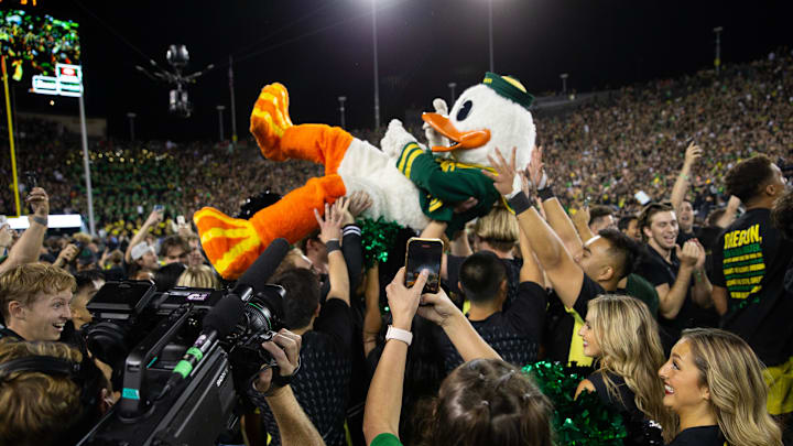The Oregon Ducks surfs the crowd after the football team defeated Ohio State at Autzen Stadium Saturday, Oct. 12, 2024.