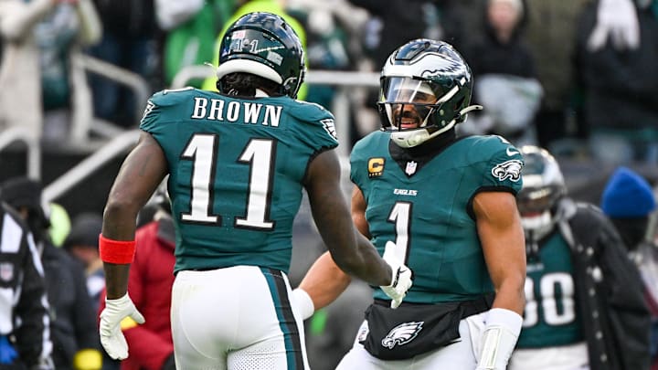 Dec 14, 2025; Philadelphia, Pennsylvania, USA; Philadelphia Eagles wide receiver A.J. Brown (11) and quarterback Jalen Hurts (1) celebrate after scoring a touchdown during the third quarter against the Las Vegas Raiders at Lincoln Financial Field. Mandatory Credit: Eric Hartline-Imagn Images