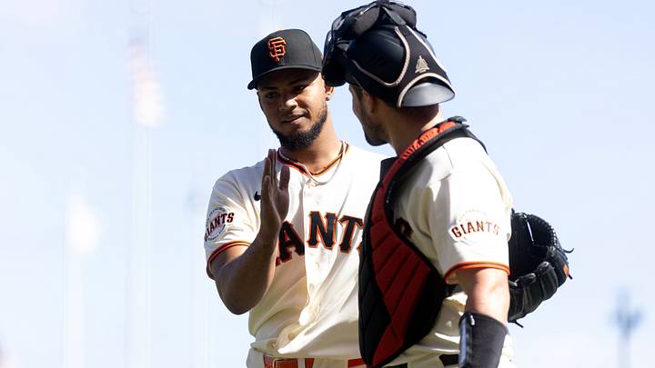 San Francisco Giants pitcher Camilo Doval (57) and catcher Drew Cavanaugh come off the field.  Credit: D. Ross Cameron-Imagn Images